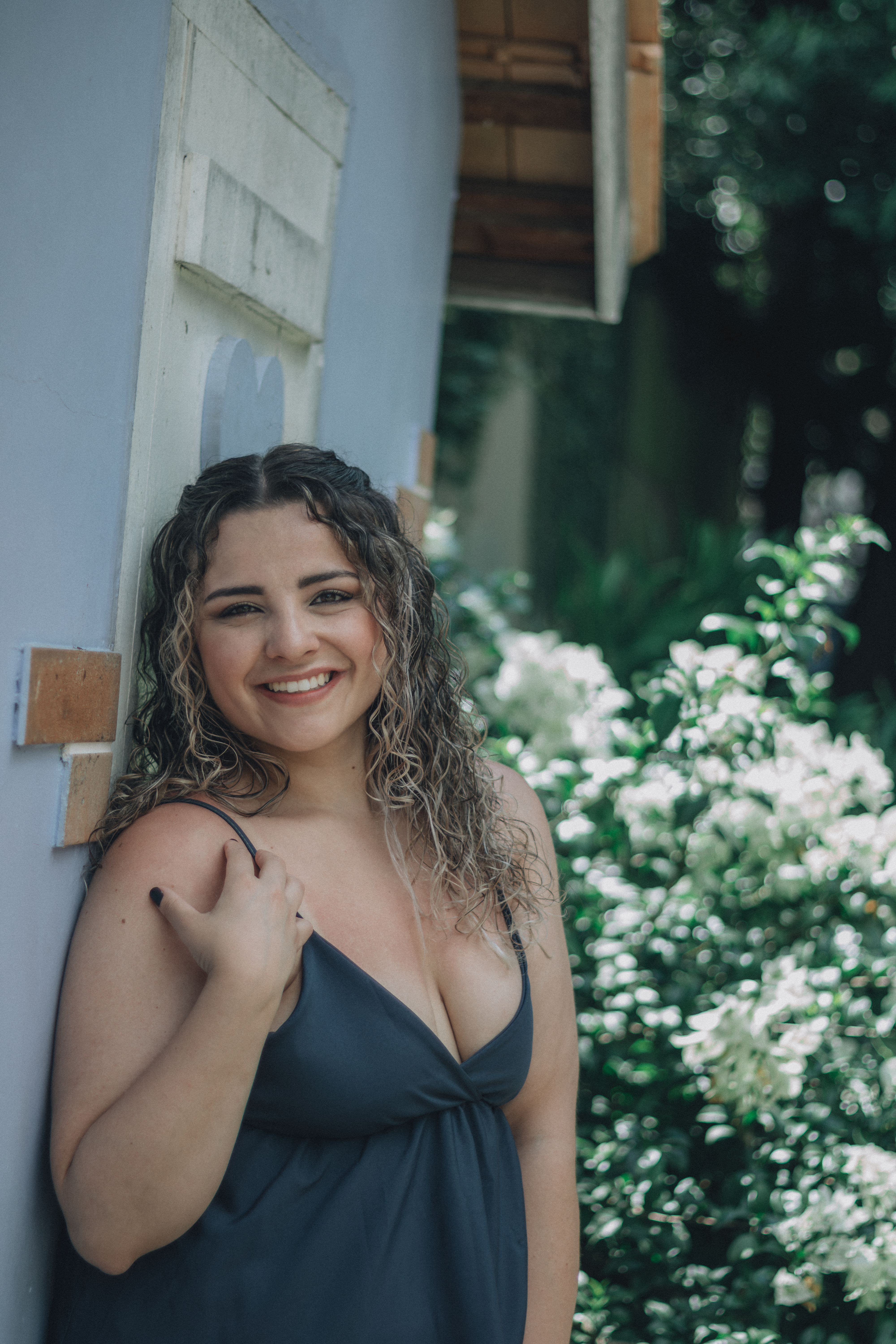Smiling Woman Posing Outdoors in Sunlight · Free Stock Photo