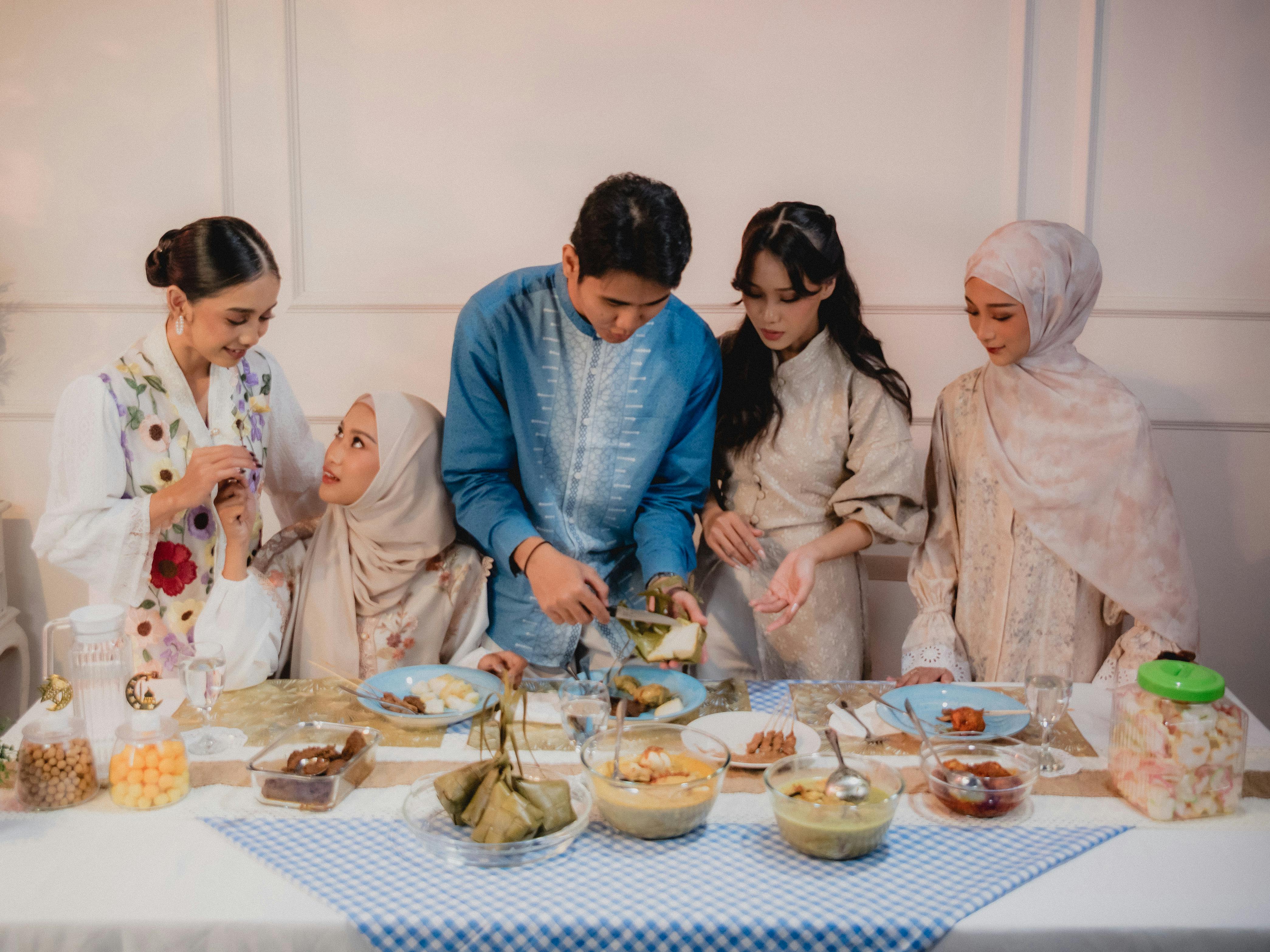 A joyful family gathering for iftar meal during Ramadan in Jakarta.