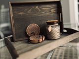 Rustic wooden coasters on a tray, photo by Yelena HeyTam on Pexels