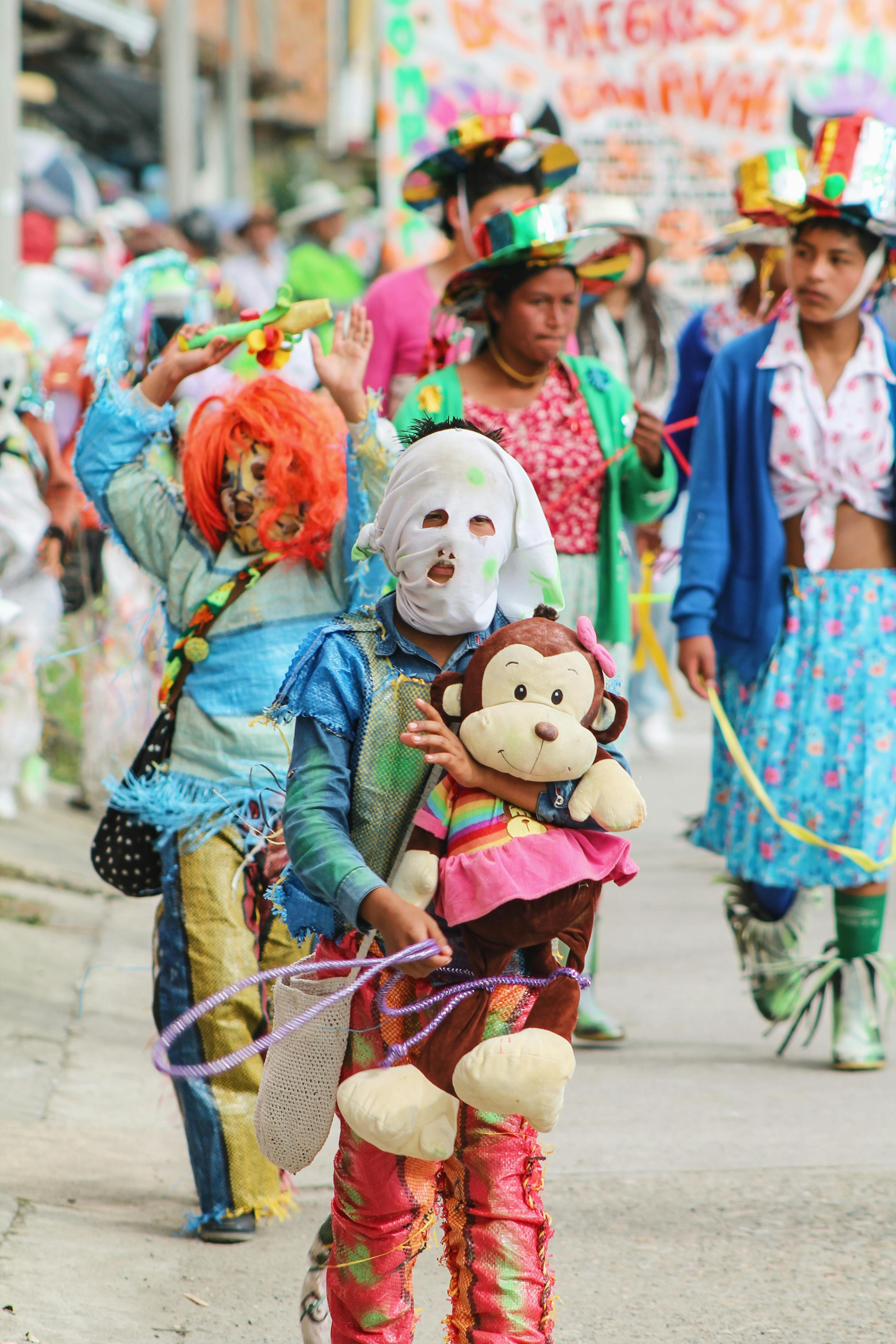 Free Vibrant festival scene with children in colorful costumes during a parade in Sibundoy, Putumayo, Colombia. Stock Photo