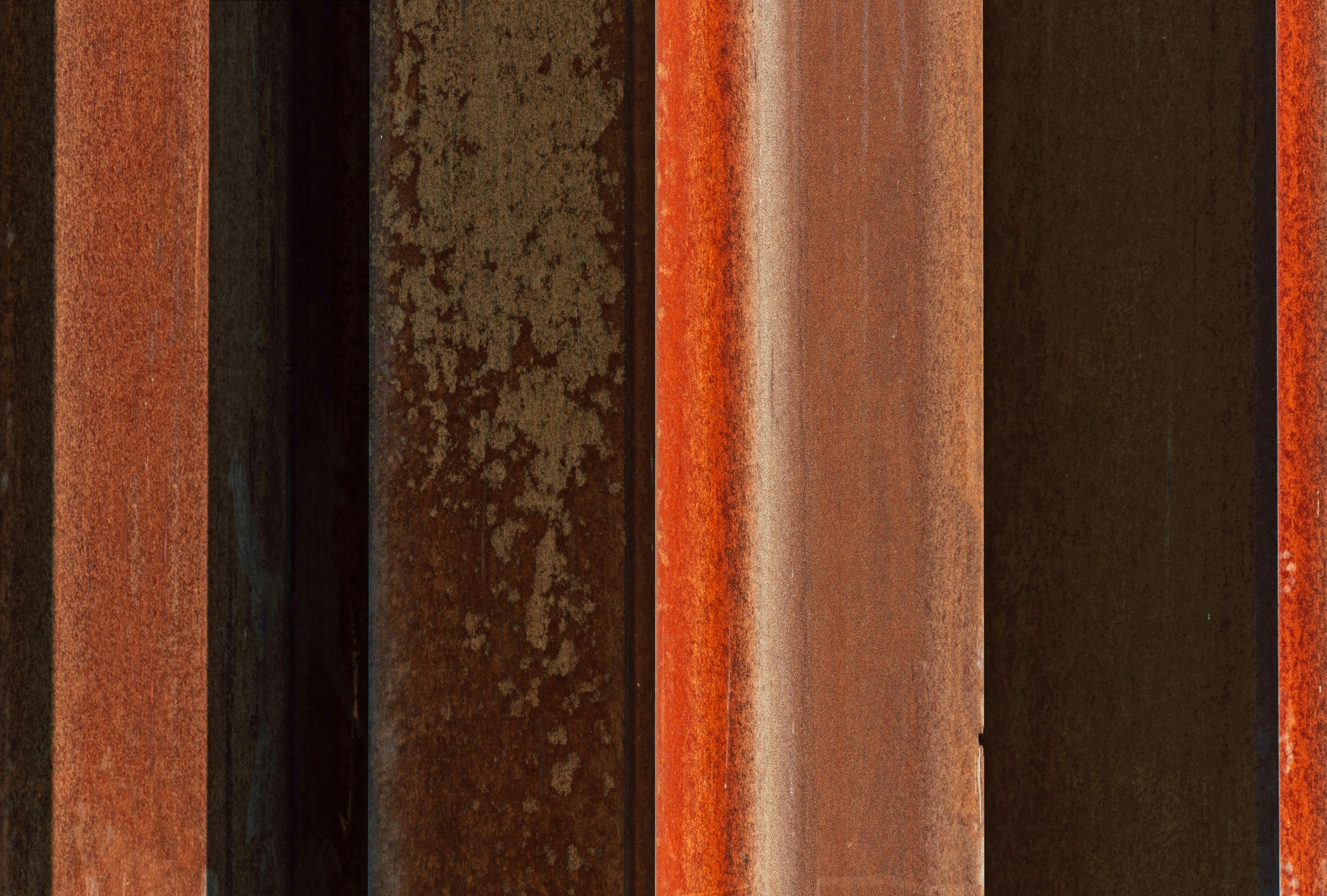 Free Detailed view of rust-covered metal beams showcasing industrial texture and color variation. Stock Photo