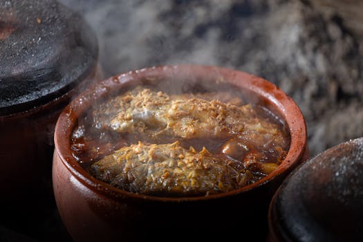 Steaming fish stew in a clay pot, a Vietnamese culinary tradition in Nam Định.