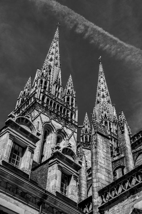 Free Dramatic black and white photo of Quimper Cathedral's intricate spires in Brittany, France. Stock Photo