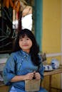 Young Woman in Traditional Asian Attire Smiling