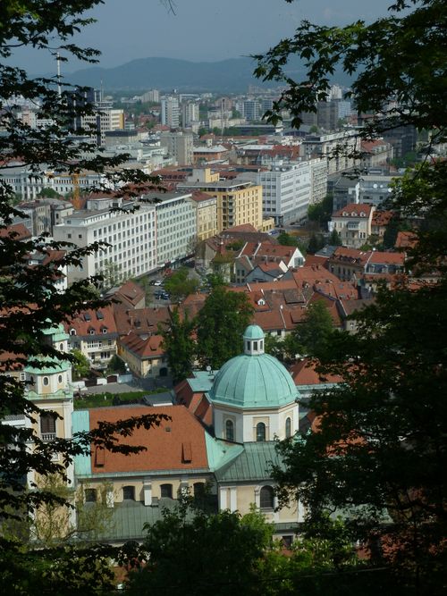 Free Explore Ljubljana with this stunning view of red rooftops and distinctive architecture. Stock Photo