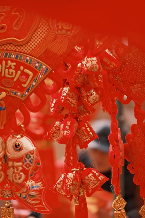 Free Red Chinese New Year decorations with intricate gold patterns celebrating festivity. Stock Photo