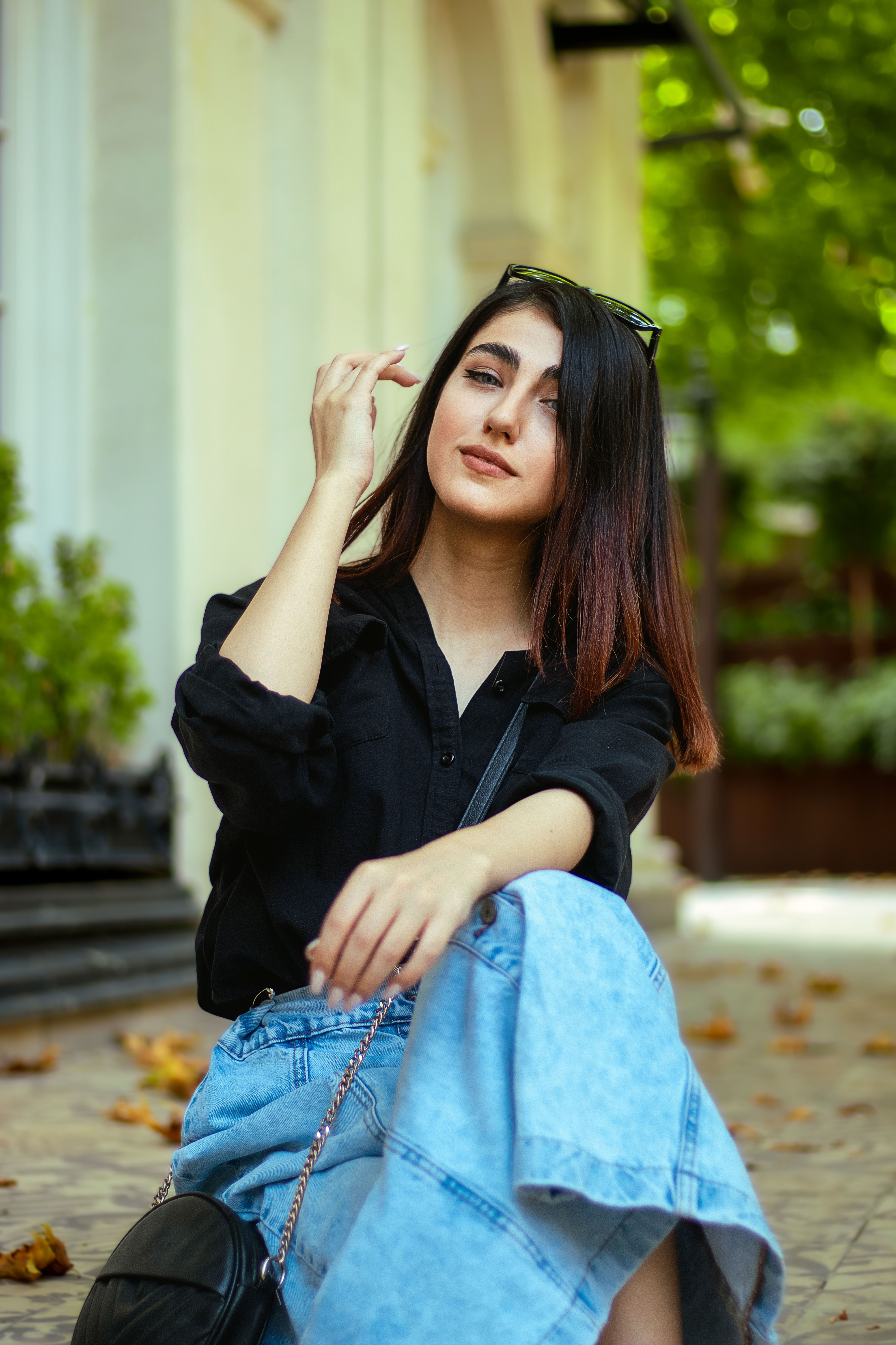 Stylish Woman Posing Outdoors in Casual Attire · Free Stock Photo