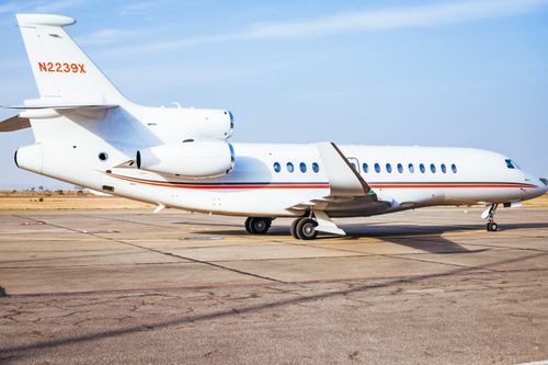 Free A sleek private jet parked on the runway under a clear sky in Jos, Nigeria. Stock Photo
