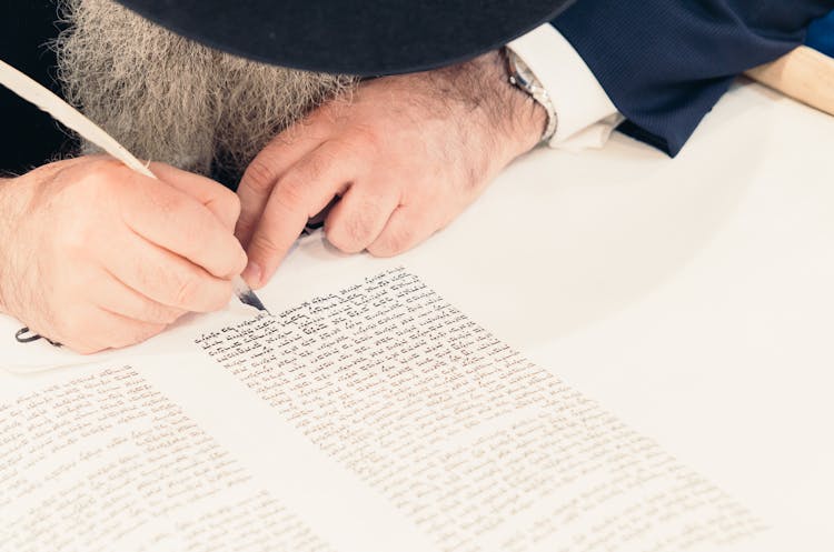 Person Writing Calligraphy