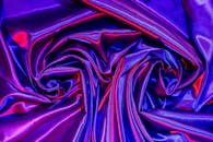 Vibrant Satin Fabric with Creative Lighting