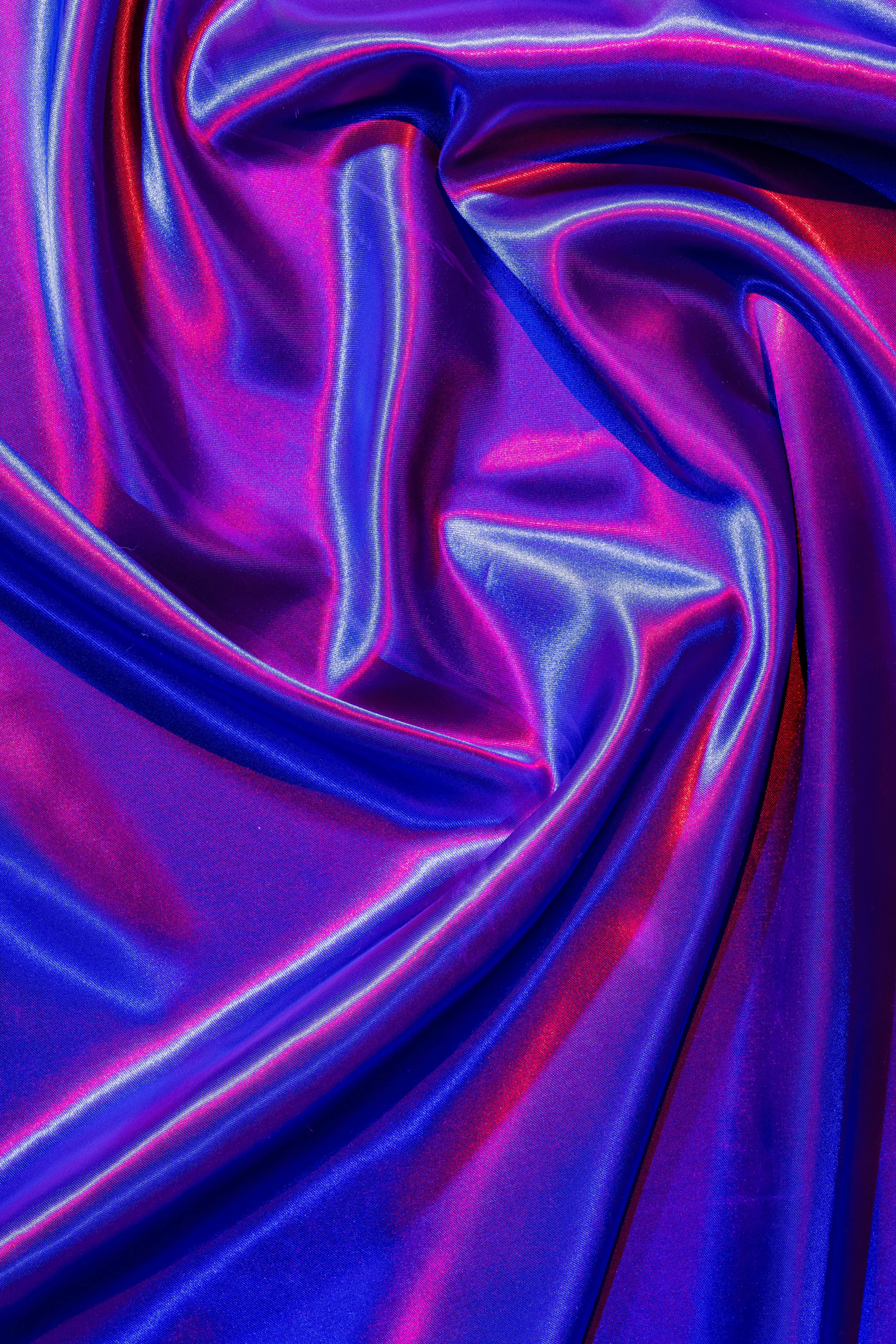 Free A vibrant and glossy abstract pattern created with colorful satin fabric folds, offering a luxurious and modern texture. Stock Photo