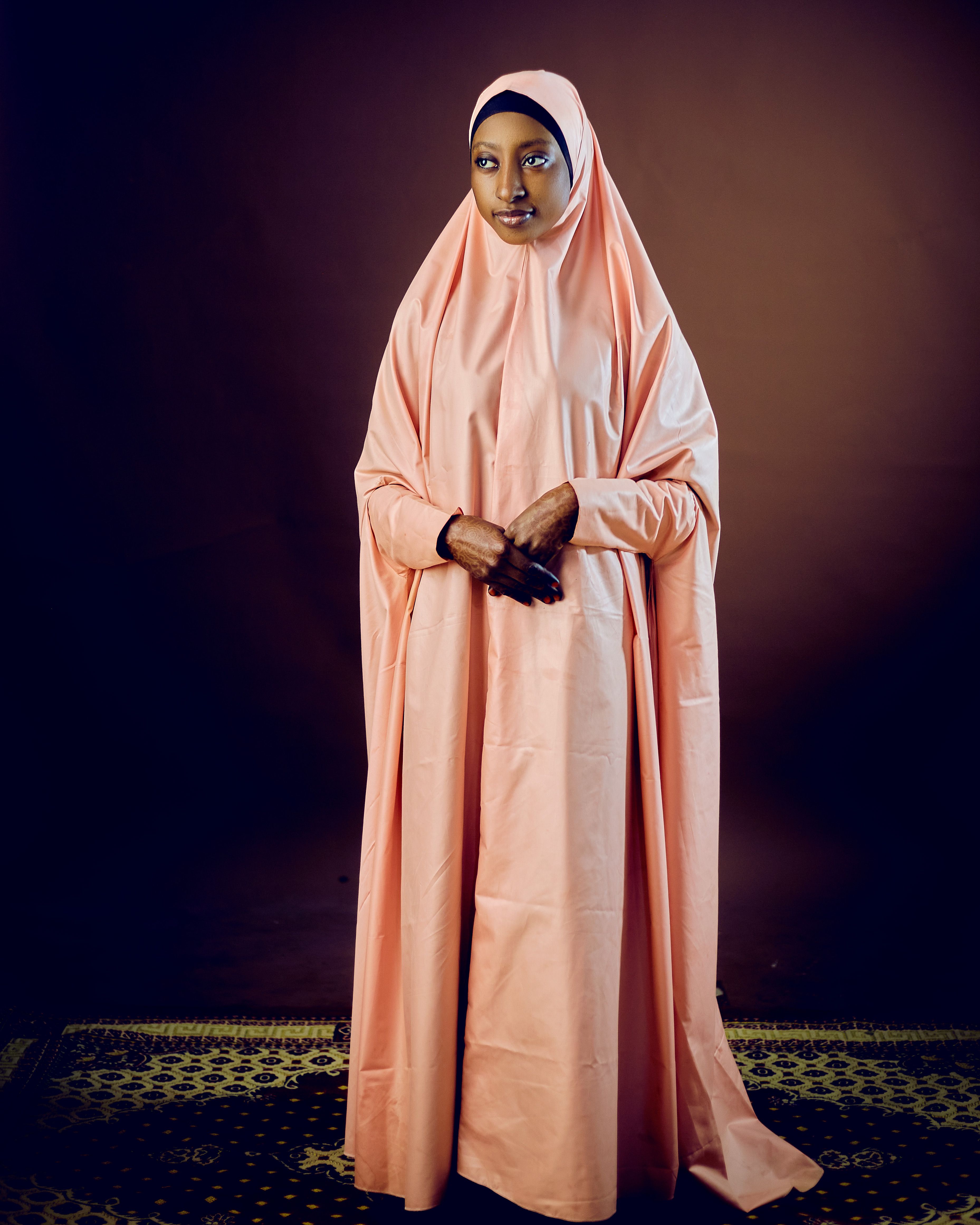 Elegant Woman in Traditional Pink Hijab Portrait · Free Stock Photo