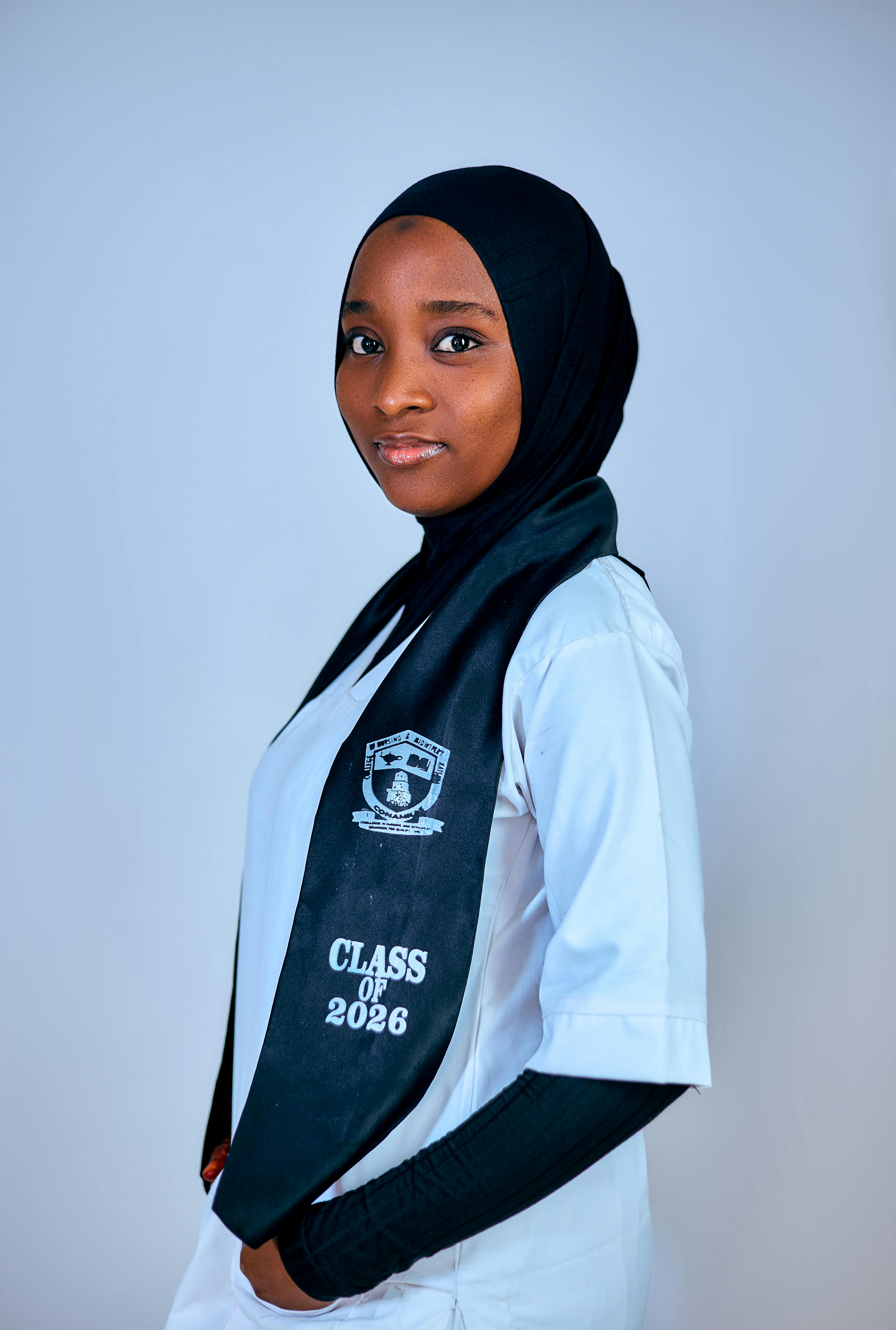 A close-up of a football with a stadium blurred in the background, representing the focus on the game ahead.