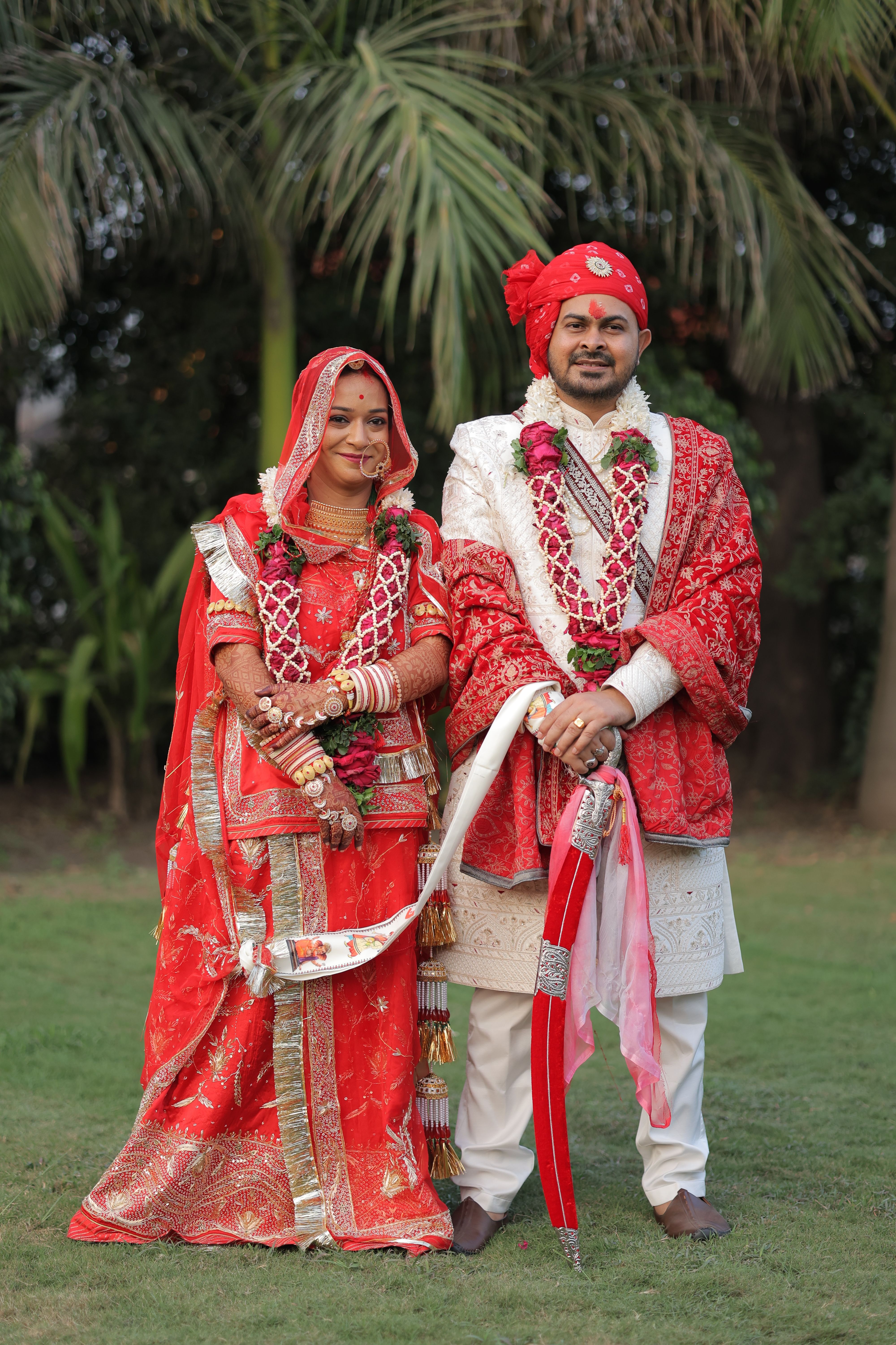 Traditional Indian Wedding Couple Posing Outdoors · Free Stock Photo