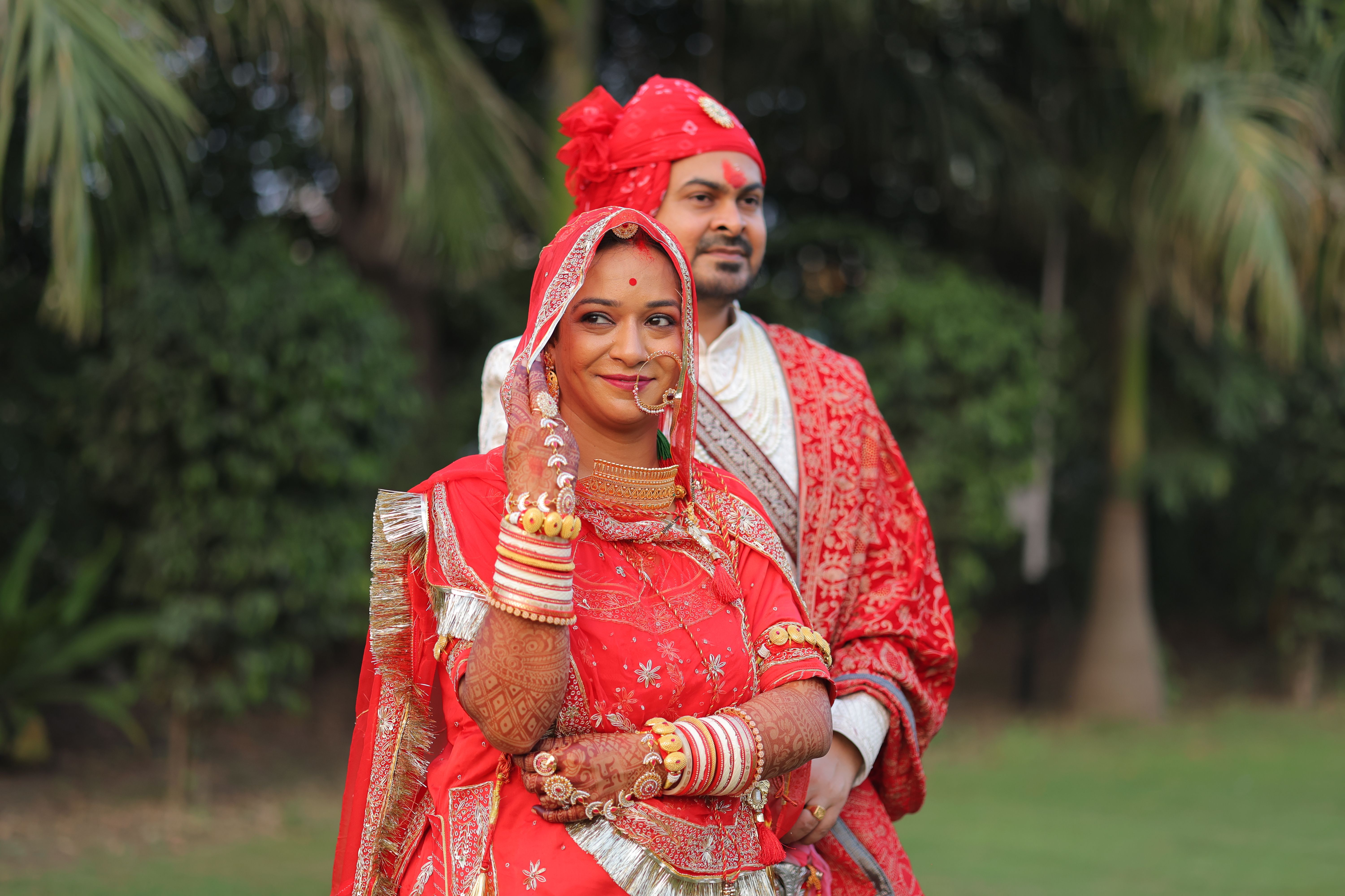 Traditional Indian Wedding Couple in Red Attire · Free Stock Photo