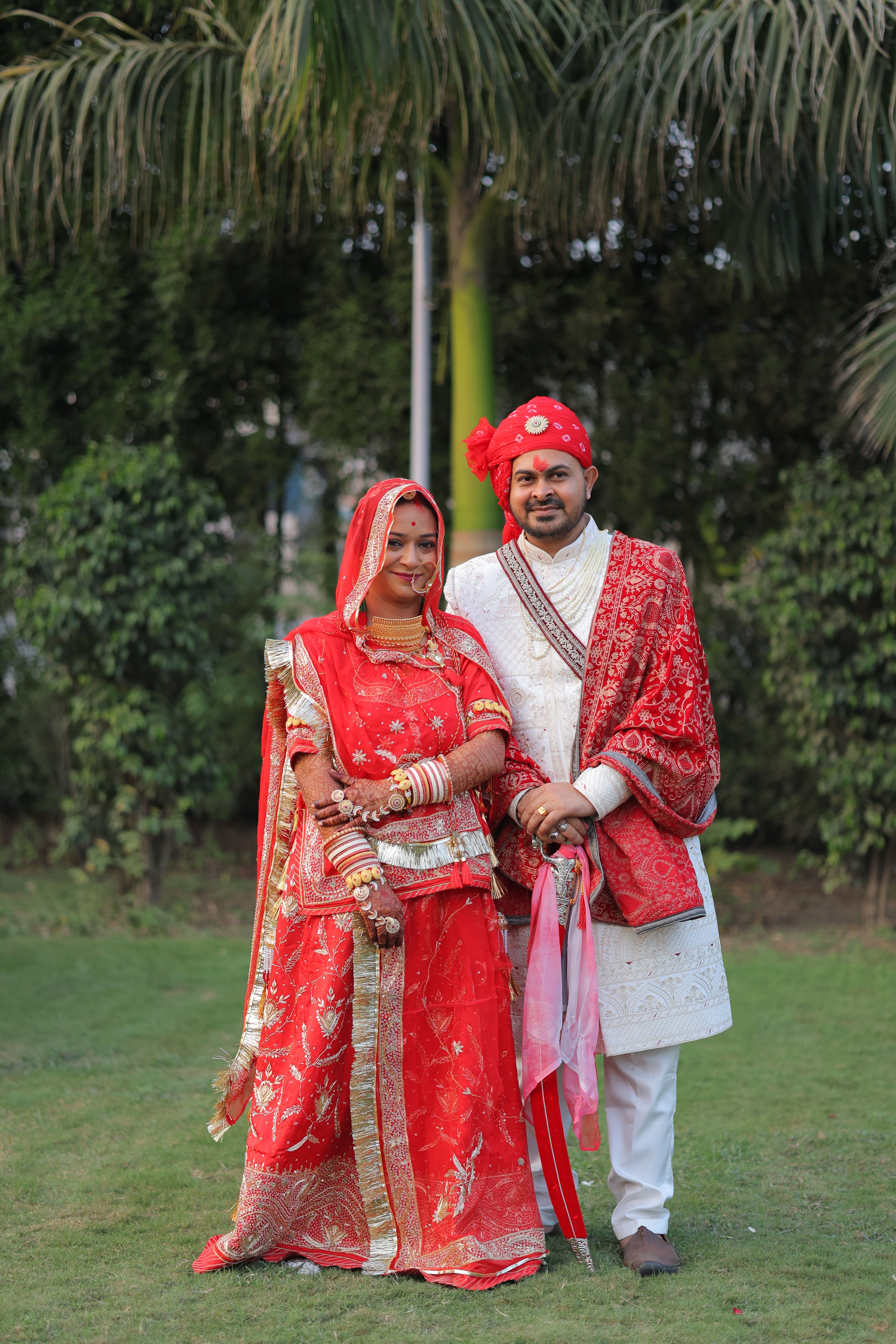 Elegant Indian Wedding Couple in Traditional Attire · Free Stock Photo