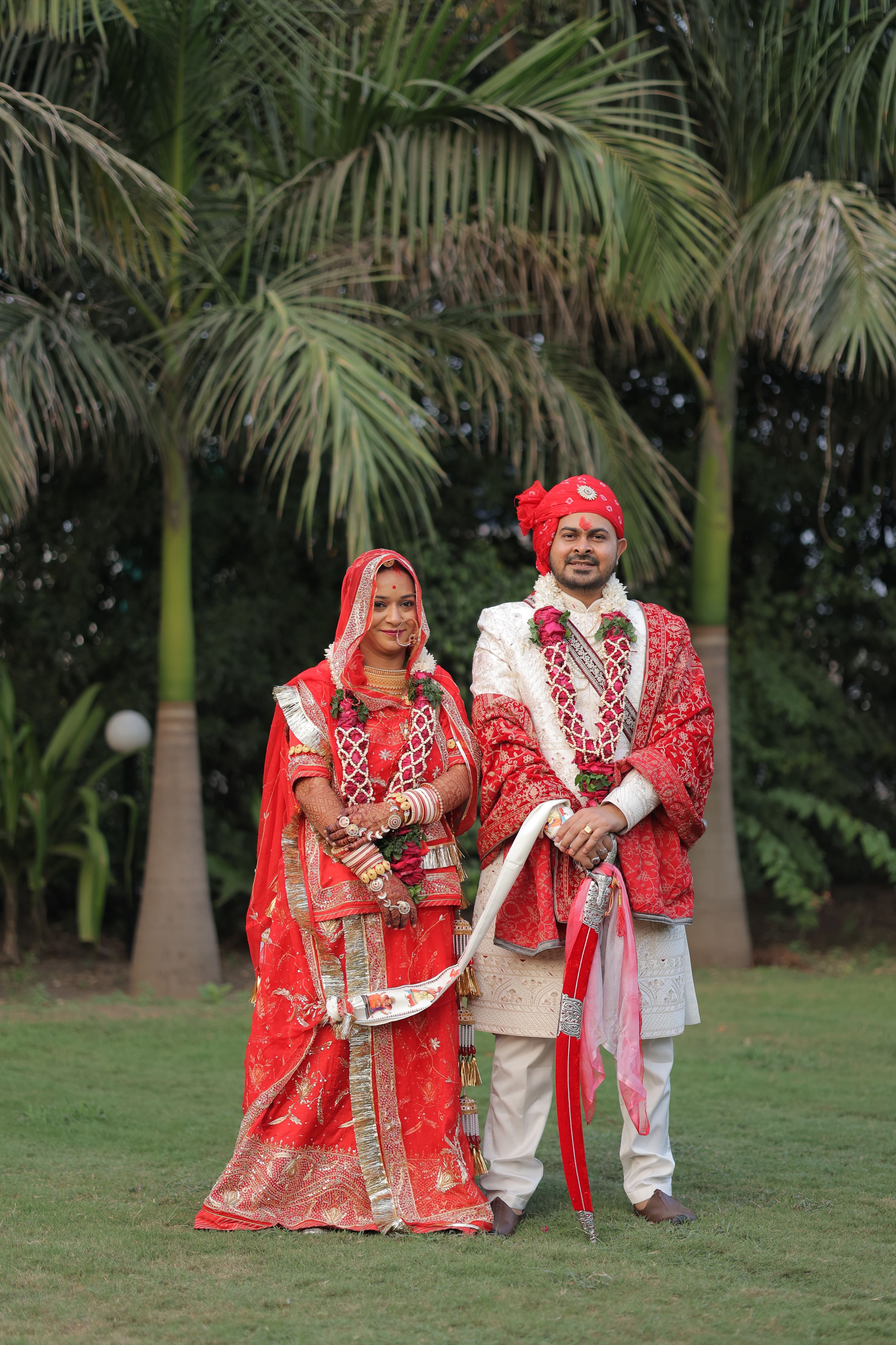 Traditional Indian Wedding Couple Outdoors in Red Attire · Free Stock Photo