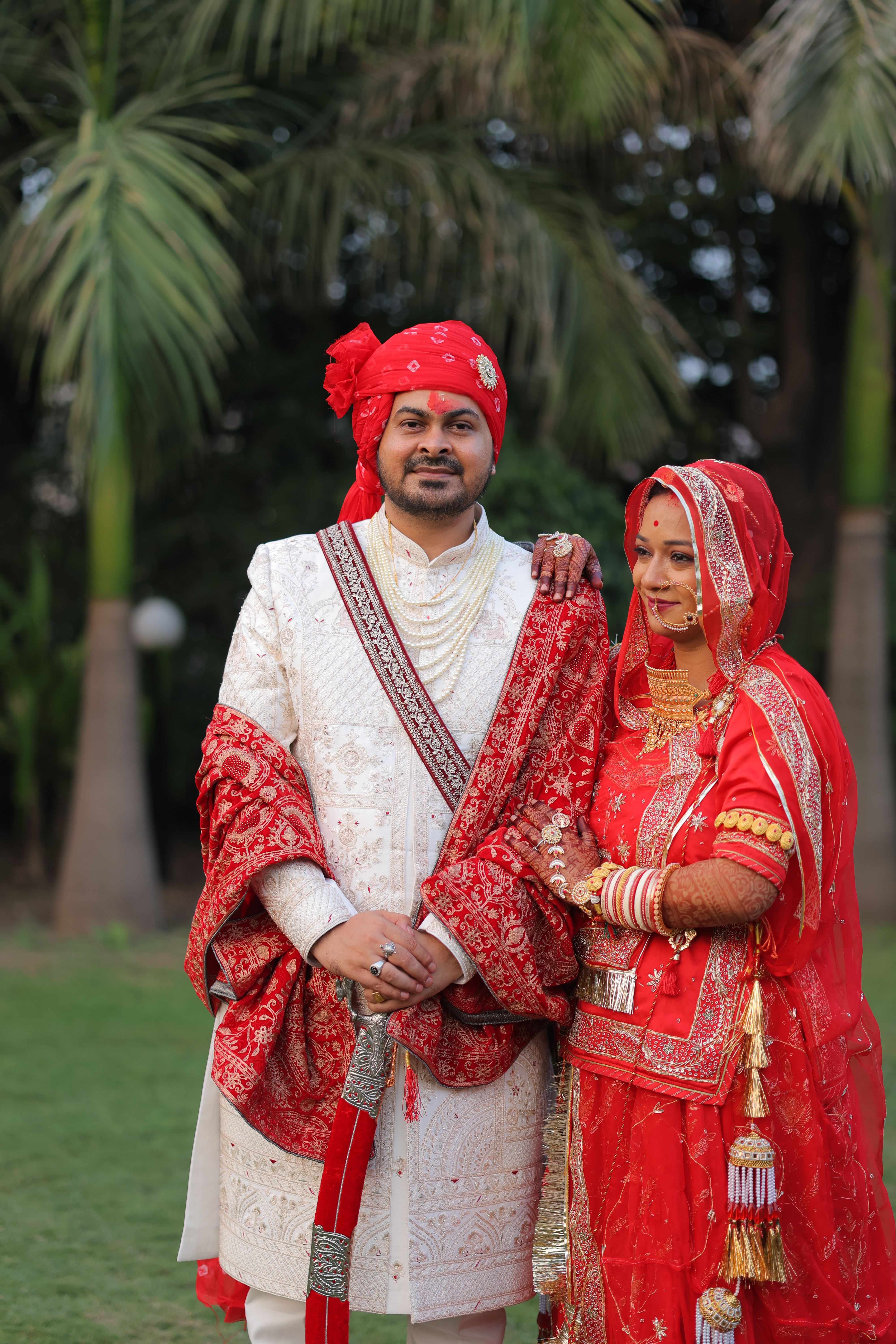 Traditional Indian Wedding Couple in Vibrant Attire · Free Stock Photo