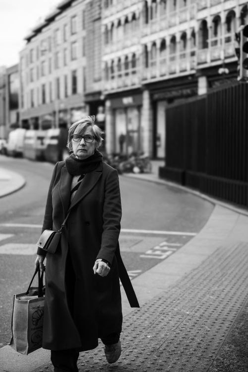 Free Monochrome image of a fashionable woman walking in Dublin, Ireland. Stock Photo