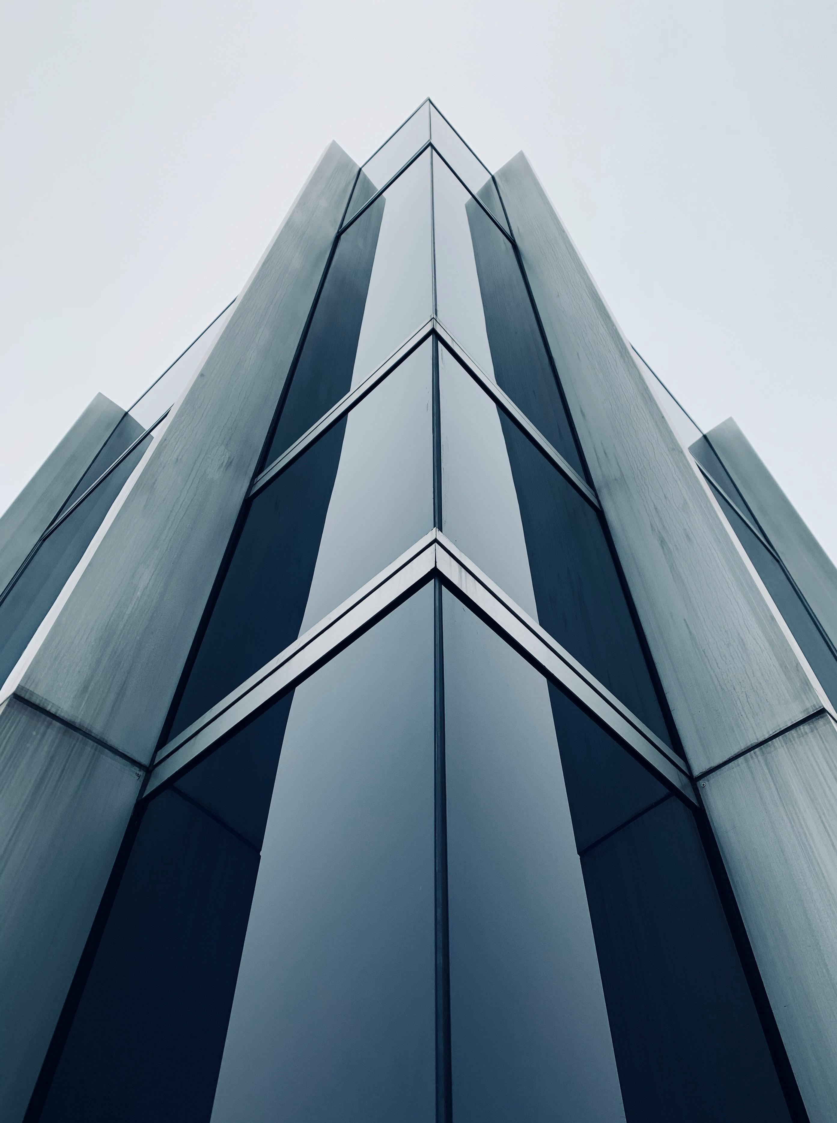 blue glass walled high rise building