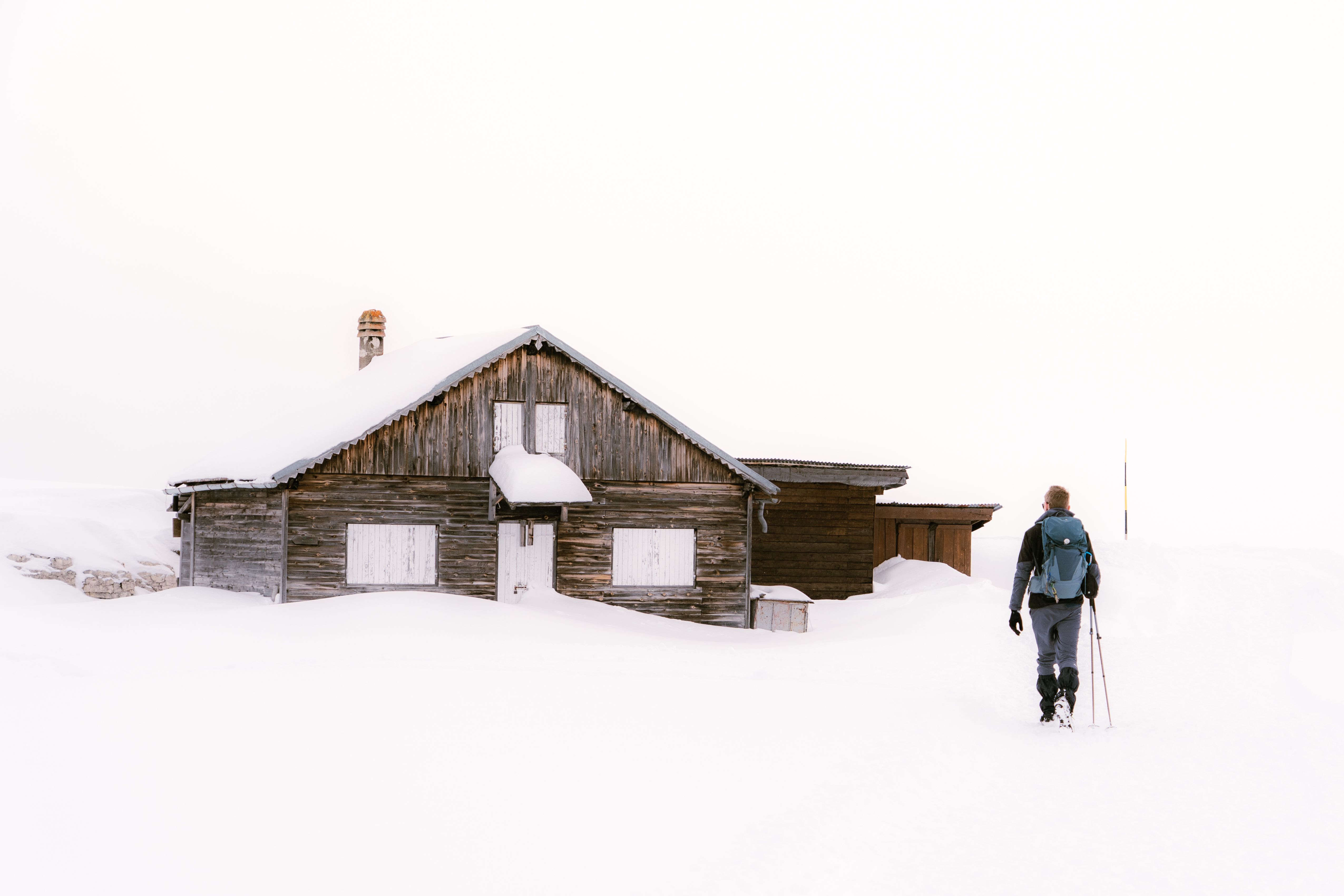 Explore a rustic mountain cabin in snowy Trentino, great for winter adventures.