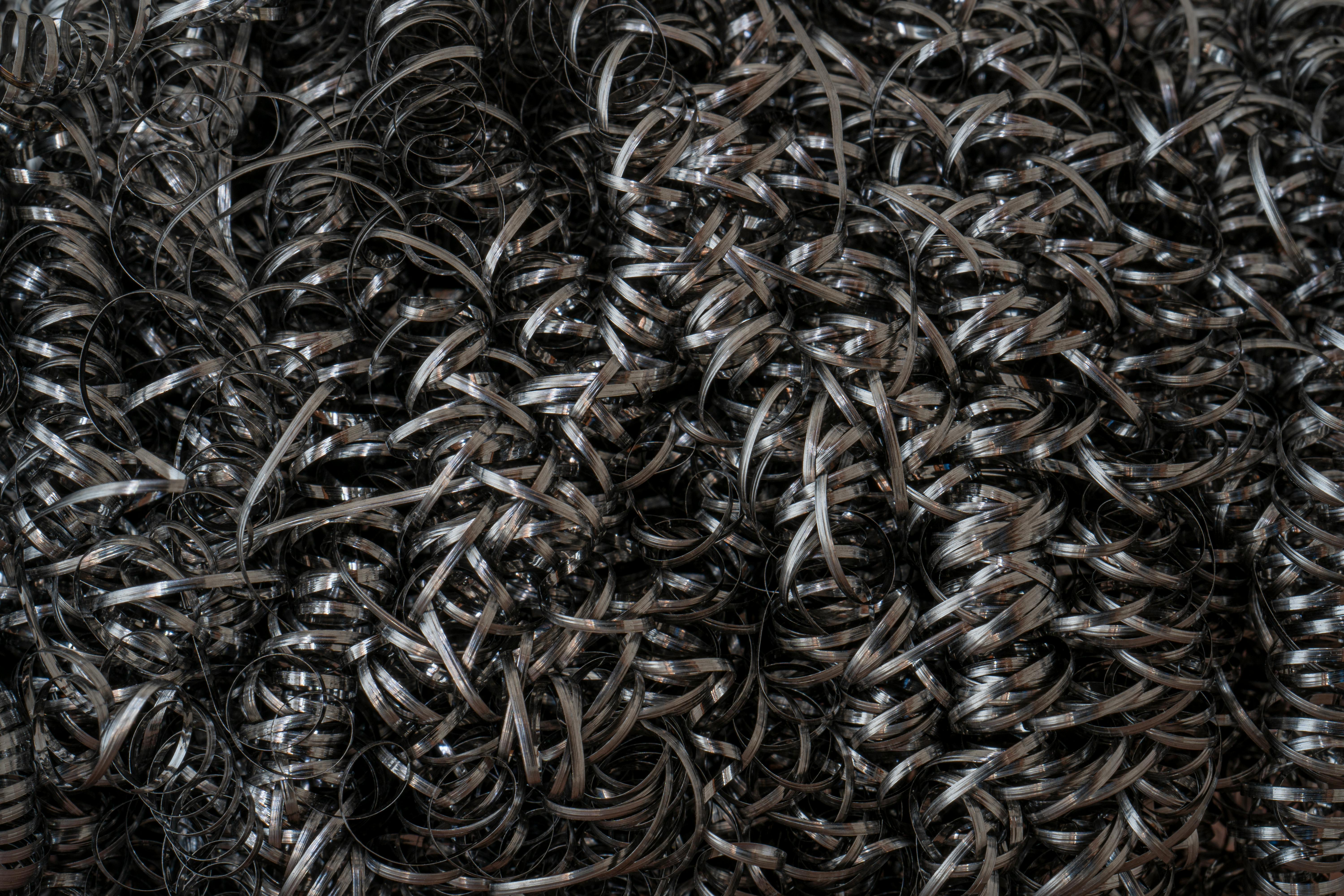 grátis Detalhe de partículas metálicas intrincadas criando padrões abstratos. Foto profissional