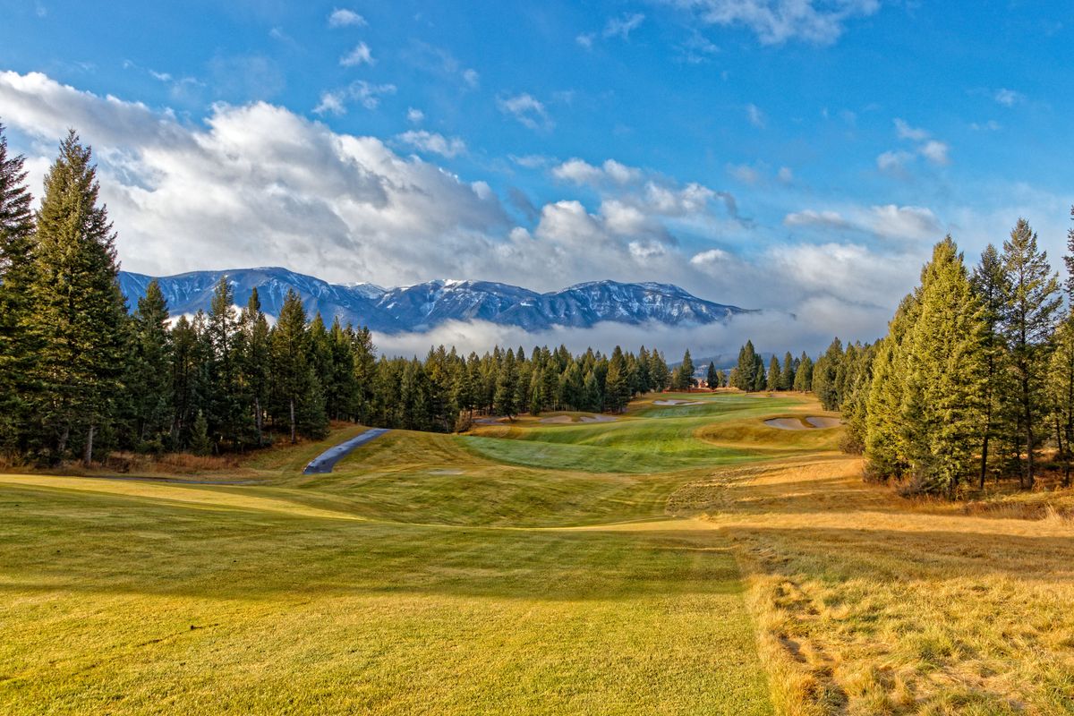 St. Eugene golf grounds with mountain backdrop