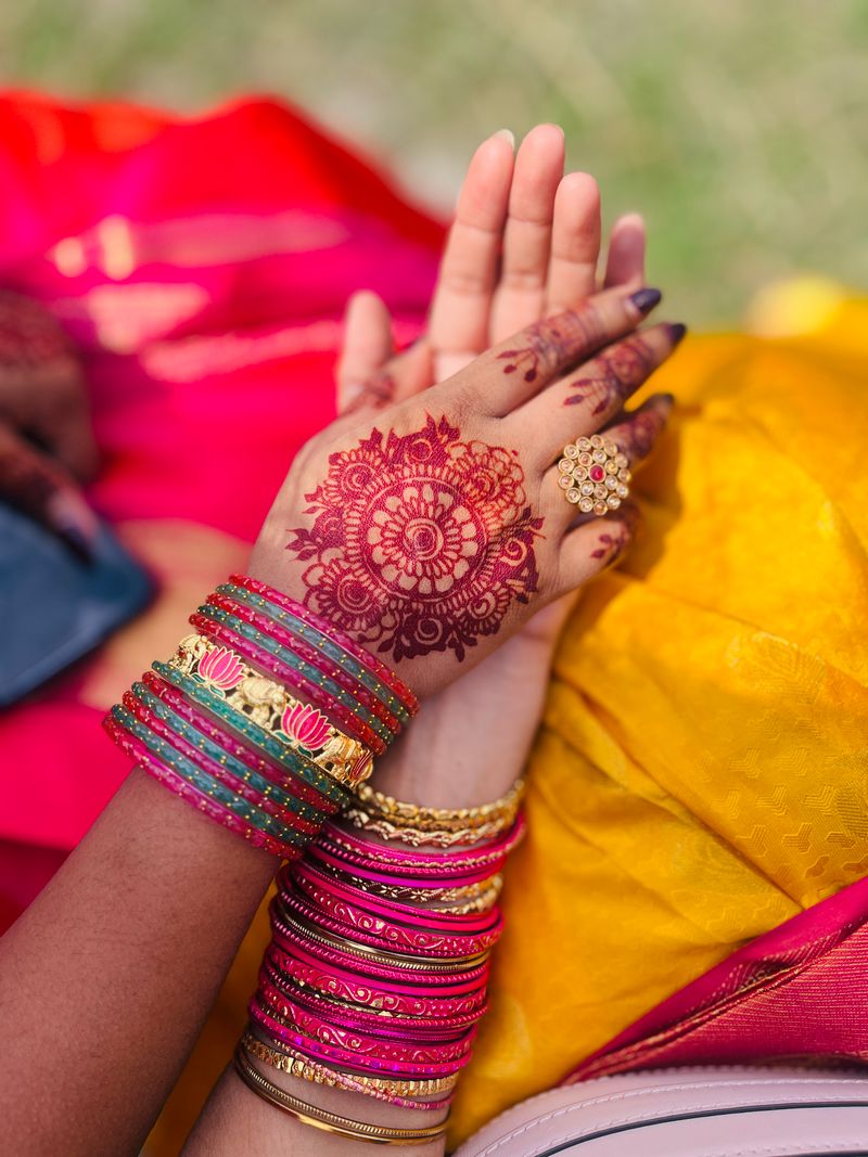 Colorful henna design with bangles at a celebration
