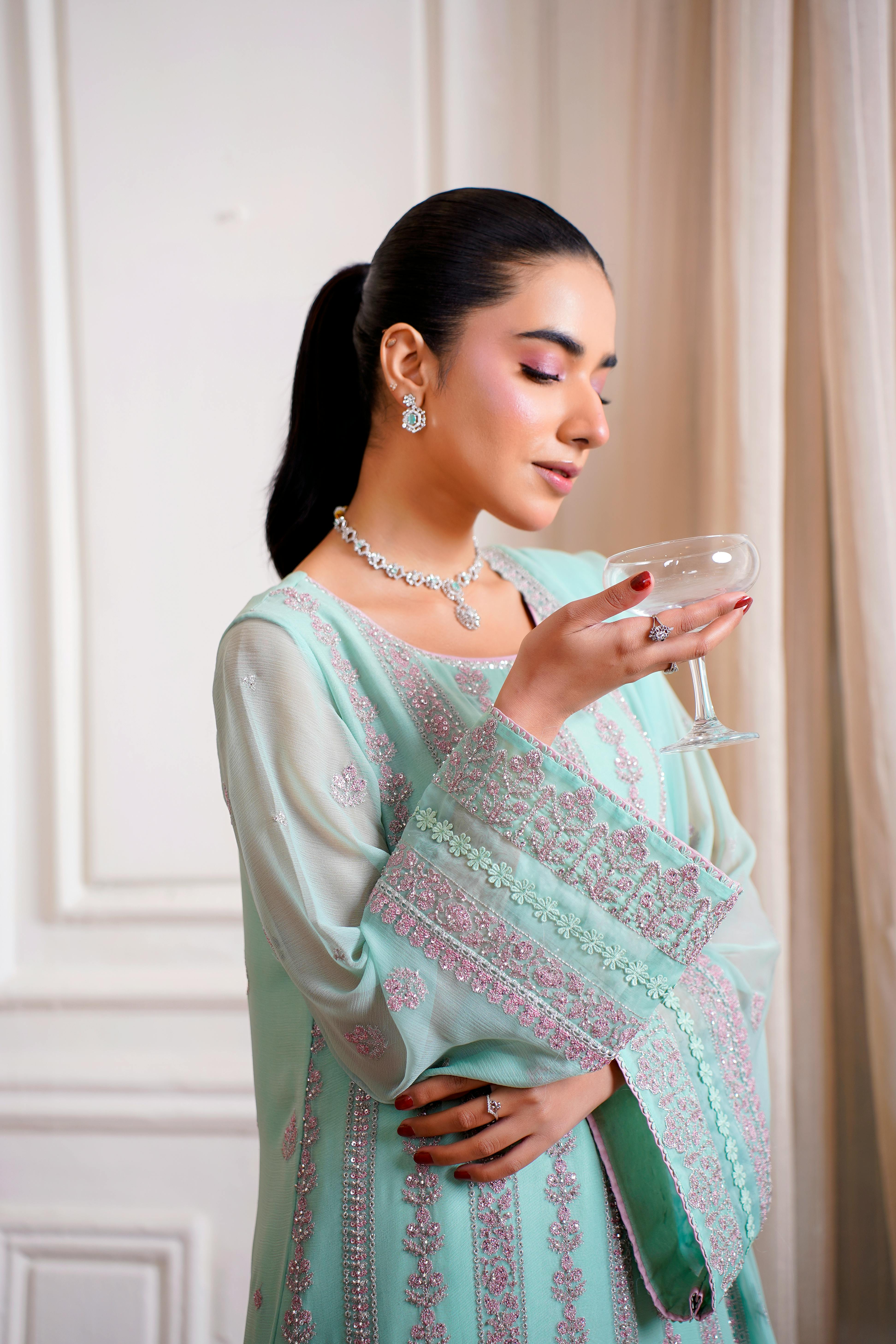 Elegant model posing in a traditional Pakistani dress in Lahore.