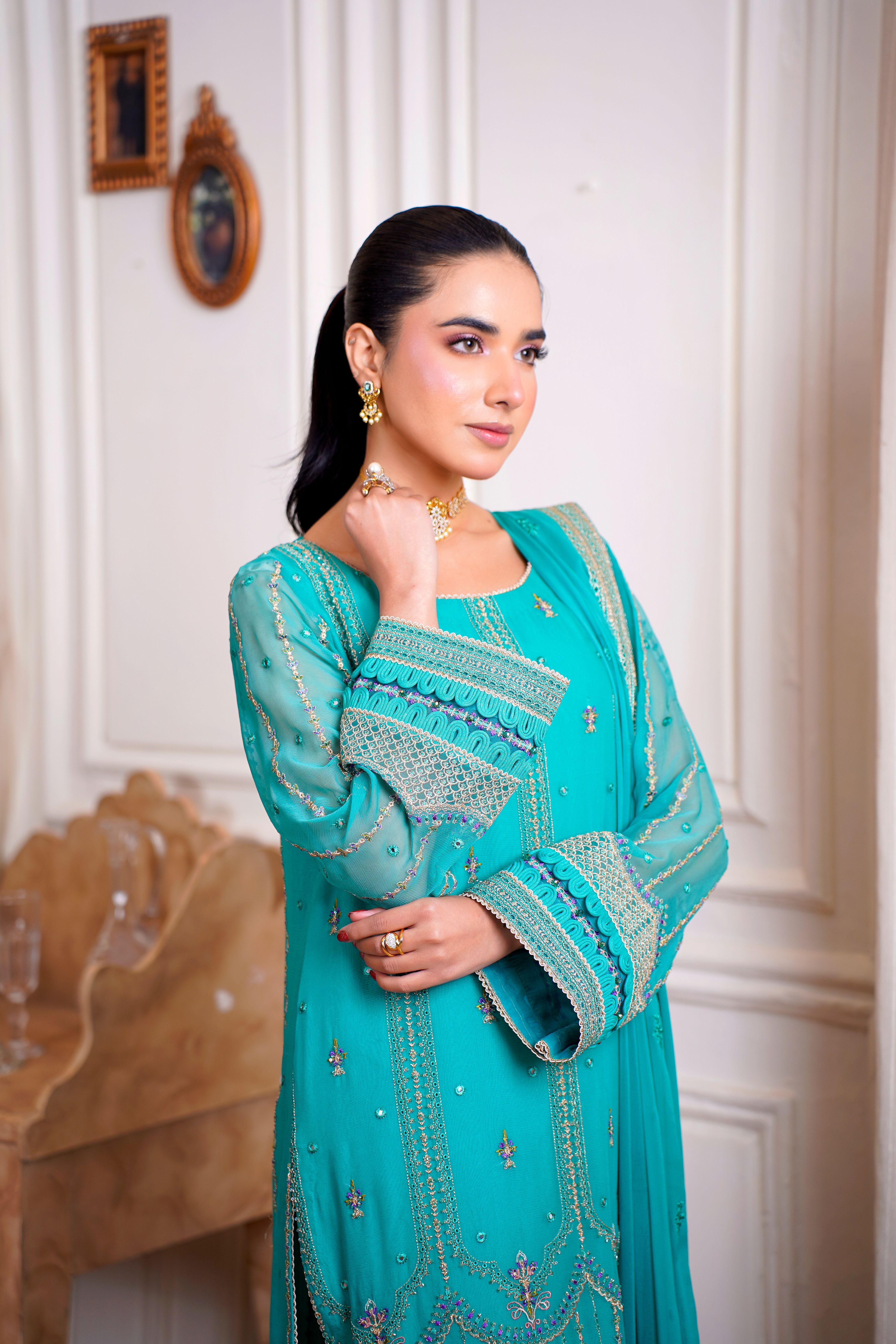 Stylish portrait of a woman in an embroidered dress capturing Lahore's fashion essence.