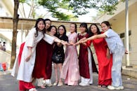 Joyful Group of Women in Traditional Attire Outdoors