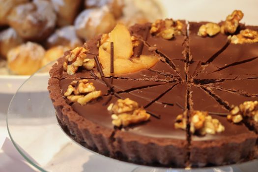 Indulge in this rich chocolate walnut tart with a perfect blend of flavors. Ideal for dessert lovers.
