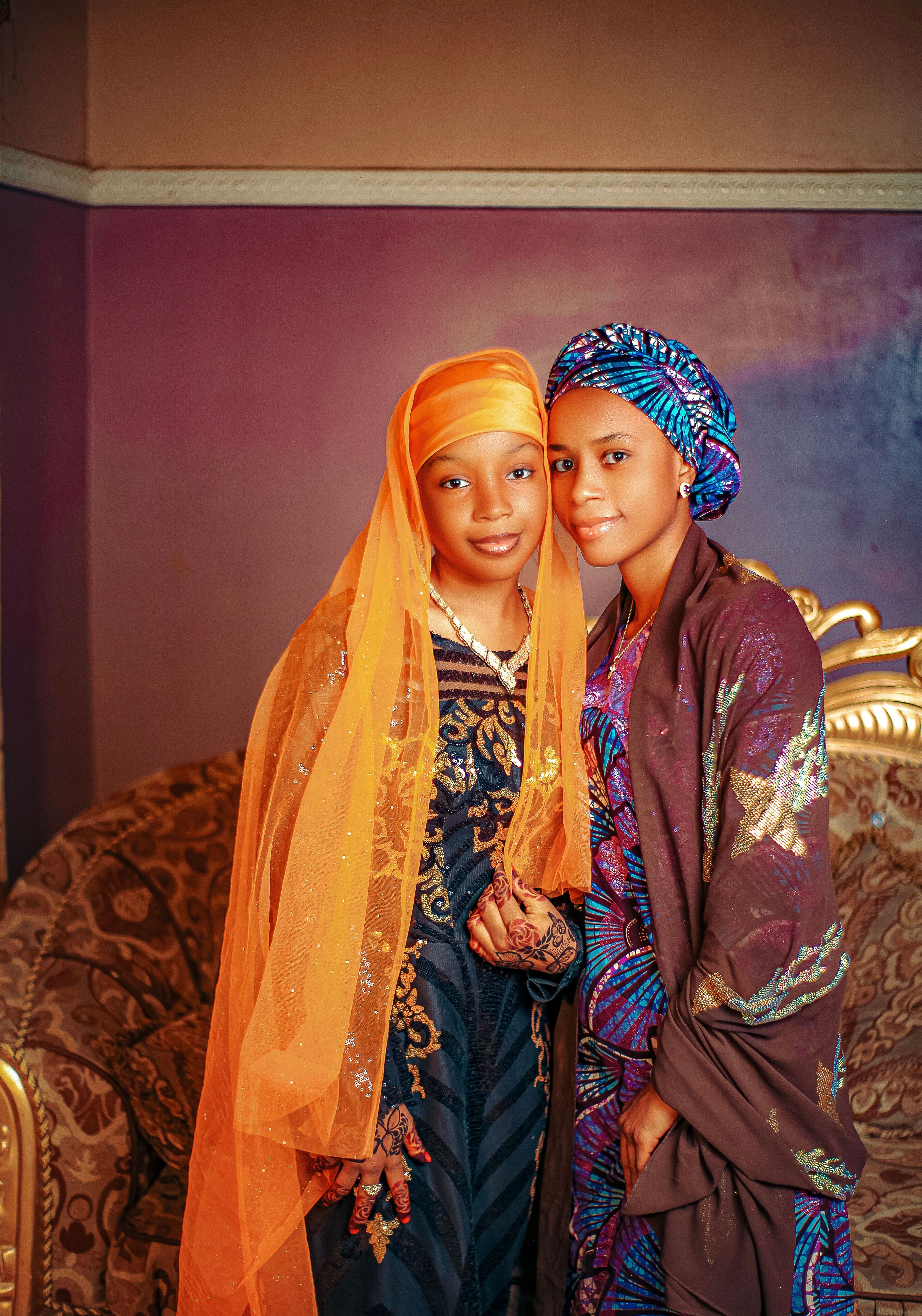 Elegant Portrait of Two Women in Traditional Attire · Free Stock Photo