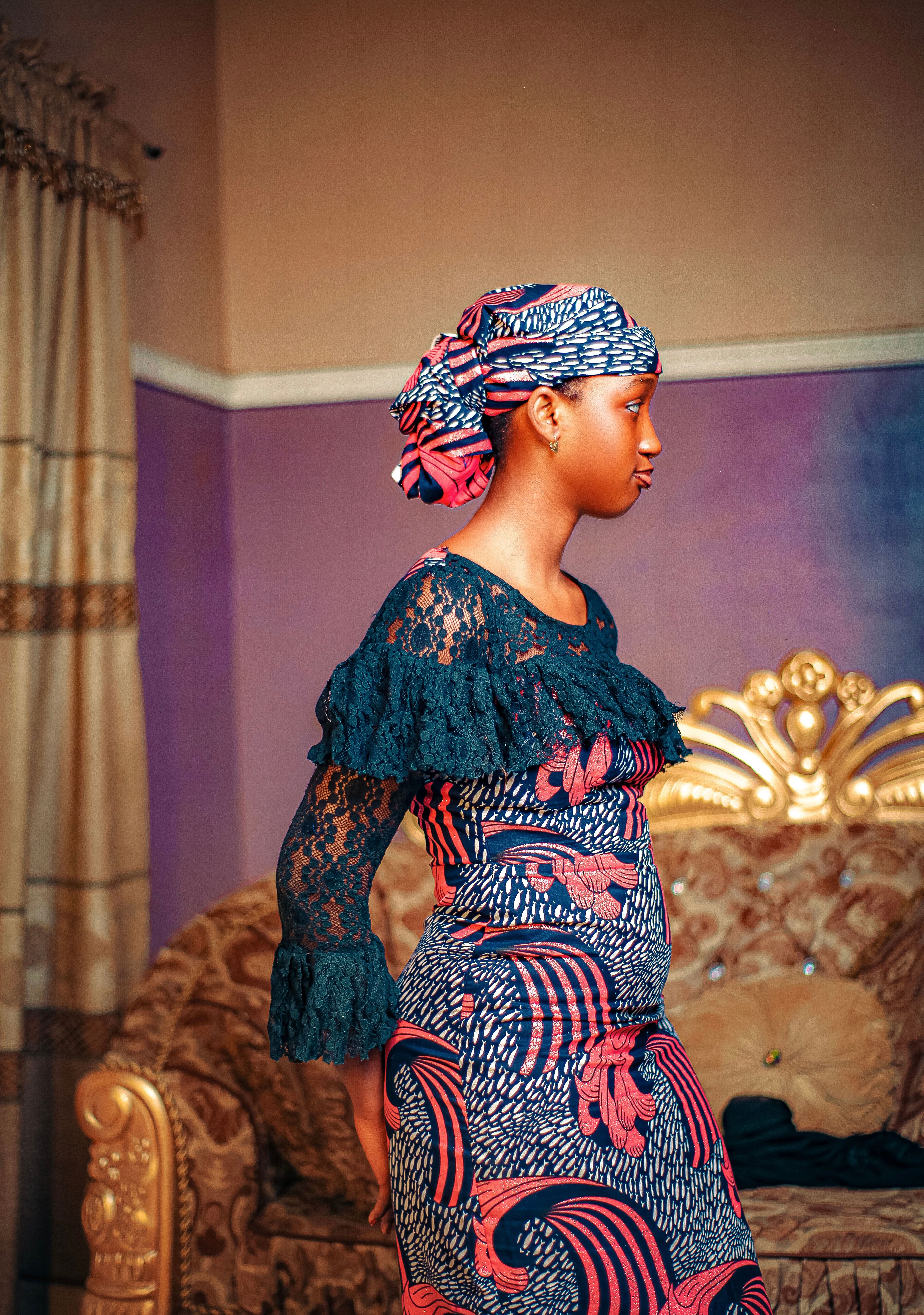Elegant Woman in Colorful Traditional Dress Indoors · Free Stock Photo