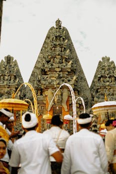 A vibrant Balinese ceremony at a historic temple with intricate architecture.
