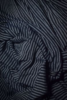 Close-up of black and gray striped fabric texture, ideal for background or pattern use.