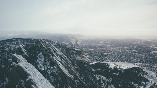 Black and White Mountains Under White Sky