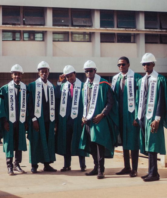 Group of chemical engineering graduates wearing caps and gowns, celebrating their graduation day outdoors. Group of chemical engineering graduates wearing caps and gowns, celebrating their graduation day outdoors.