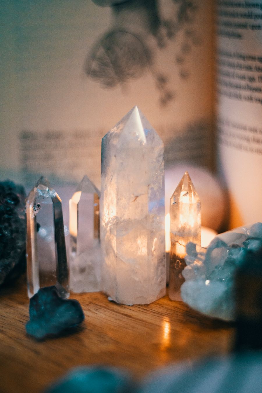 Quartz crystals on a wooden table under warm light