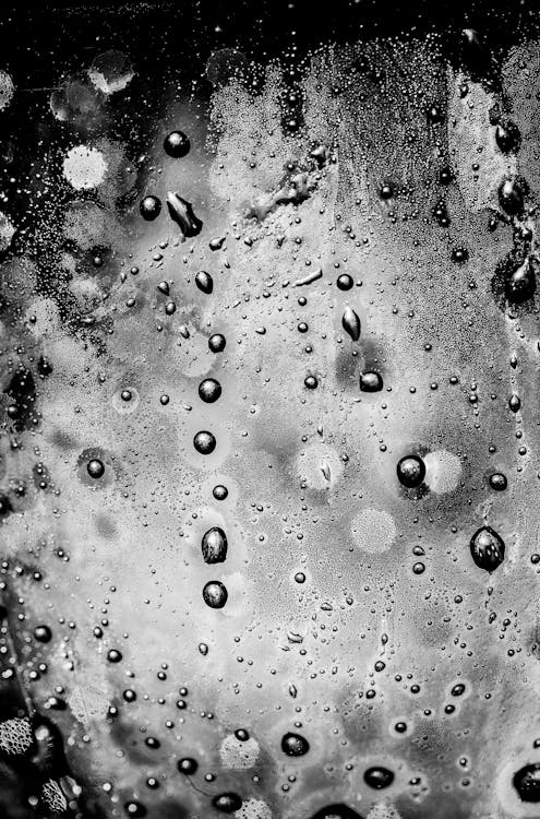 Free Water Droplets on Glass Panel Stock Photo