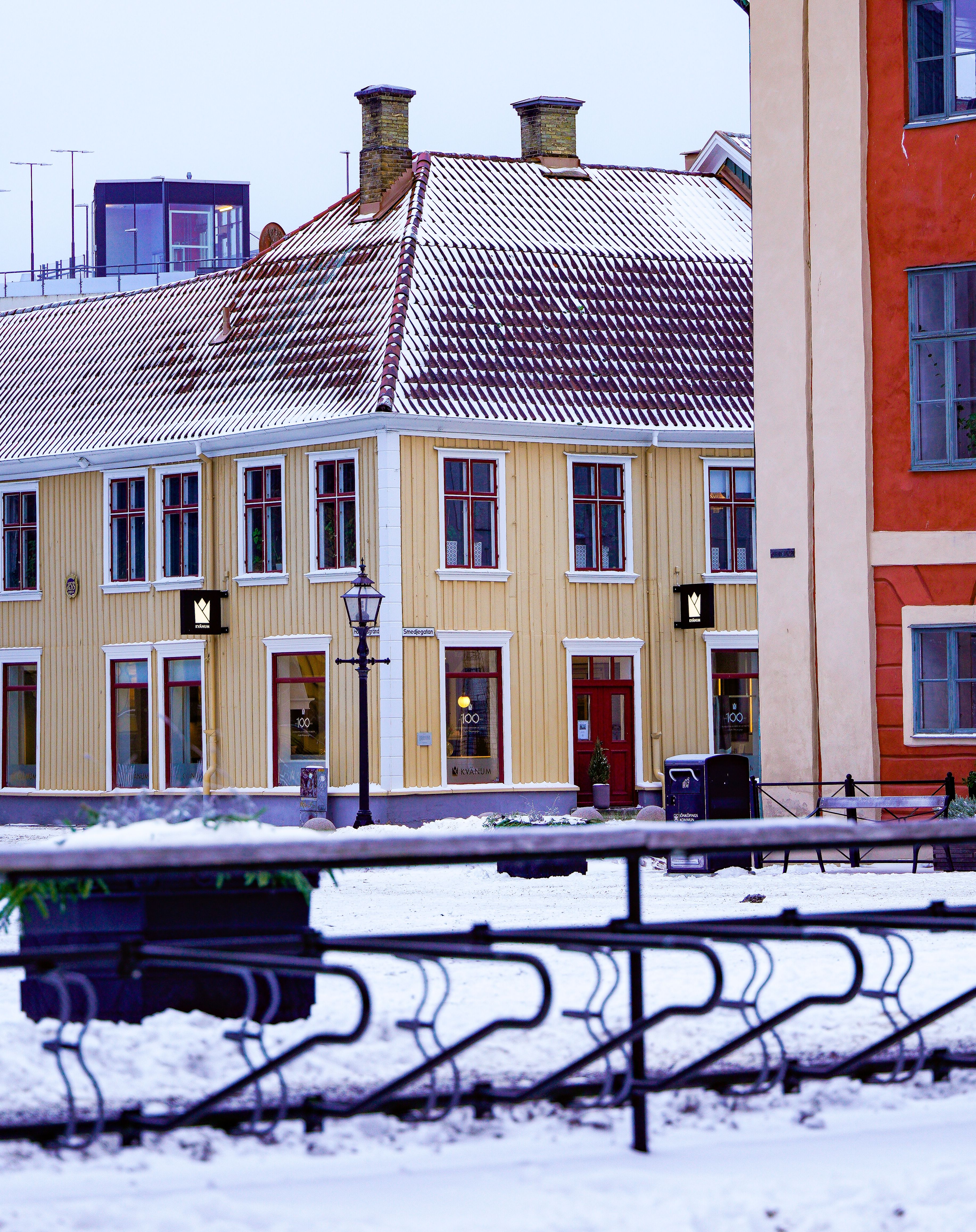 Snow-covered buildings in the historic city center of Jönköping, Sweden, during winter.
