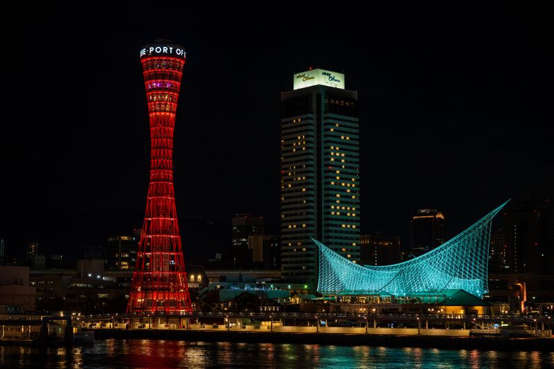 Kobe Port Tower and the sail-shaped Maritime Museum illuminated at night