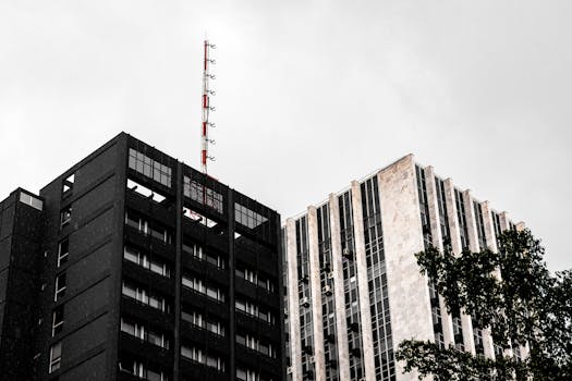 A striking view of modern high-rise buildings in São Paulo against a cloudy sky.