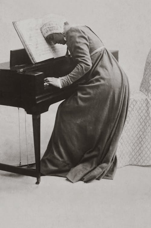 Old Photo Of Woman Playing Piano