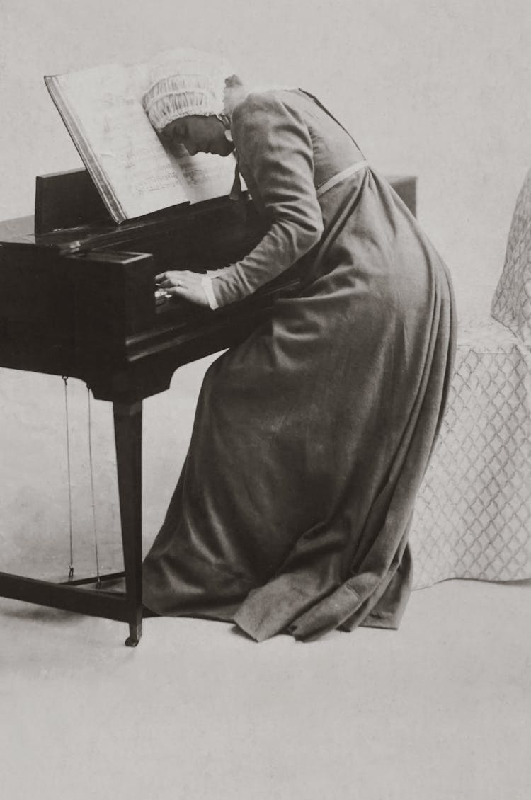 Old Photo Of Woman Playing Piano