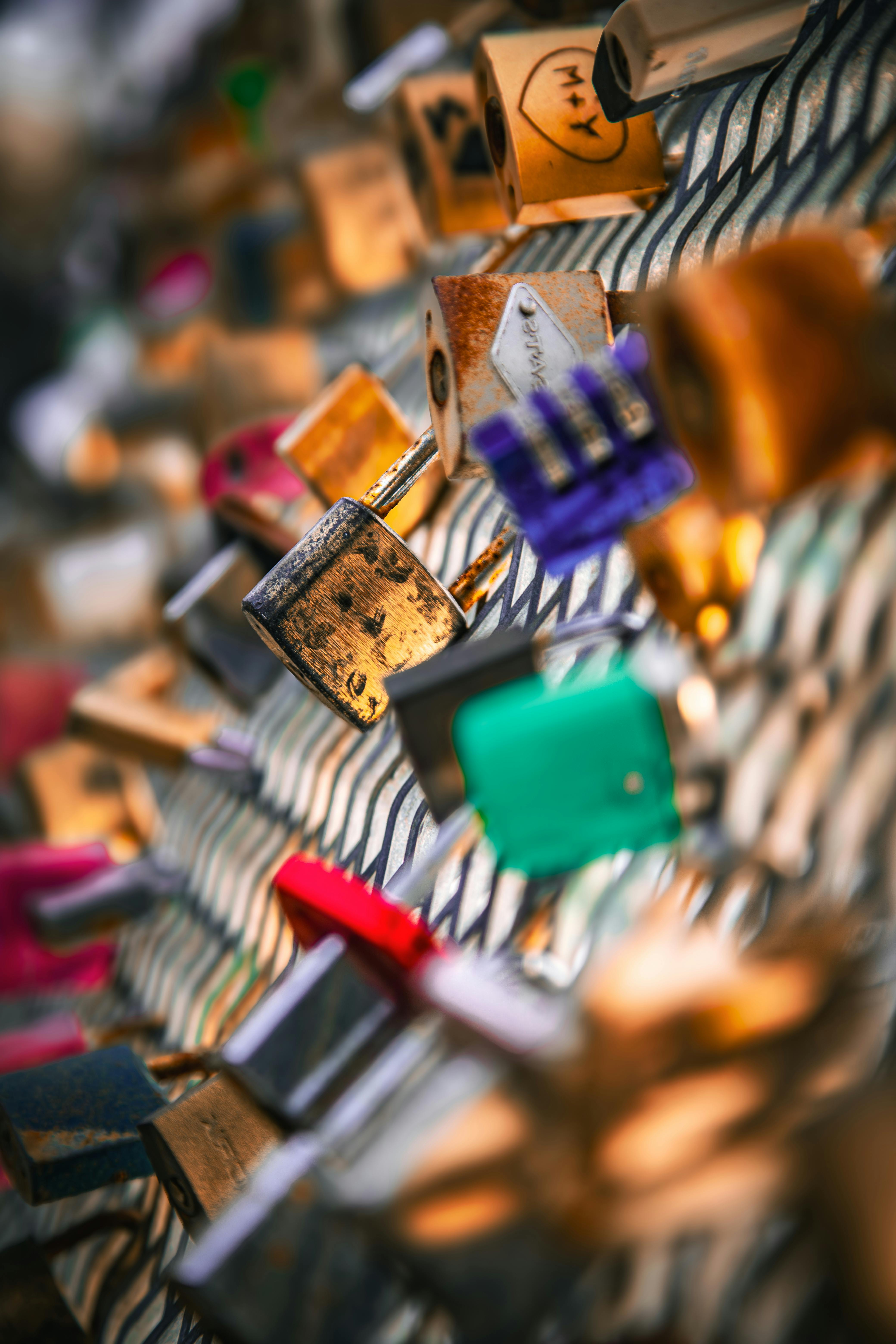 Free Close-up shot of colorful love locks attached to a metal fence, symbolizing eternal love. Stock Photo