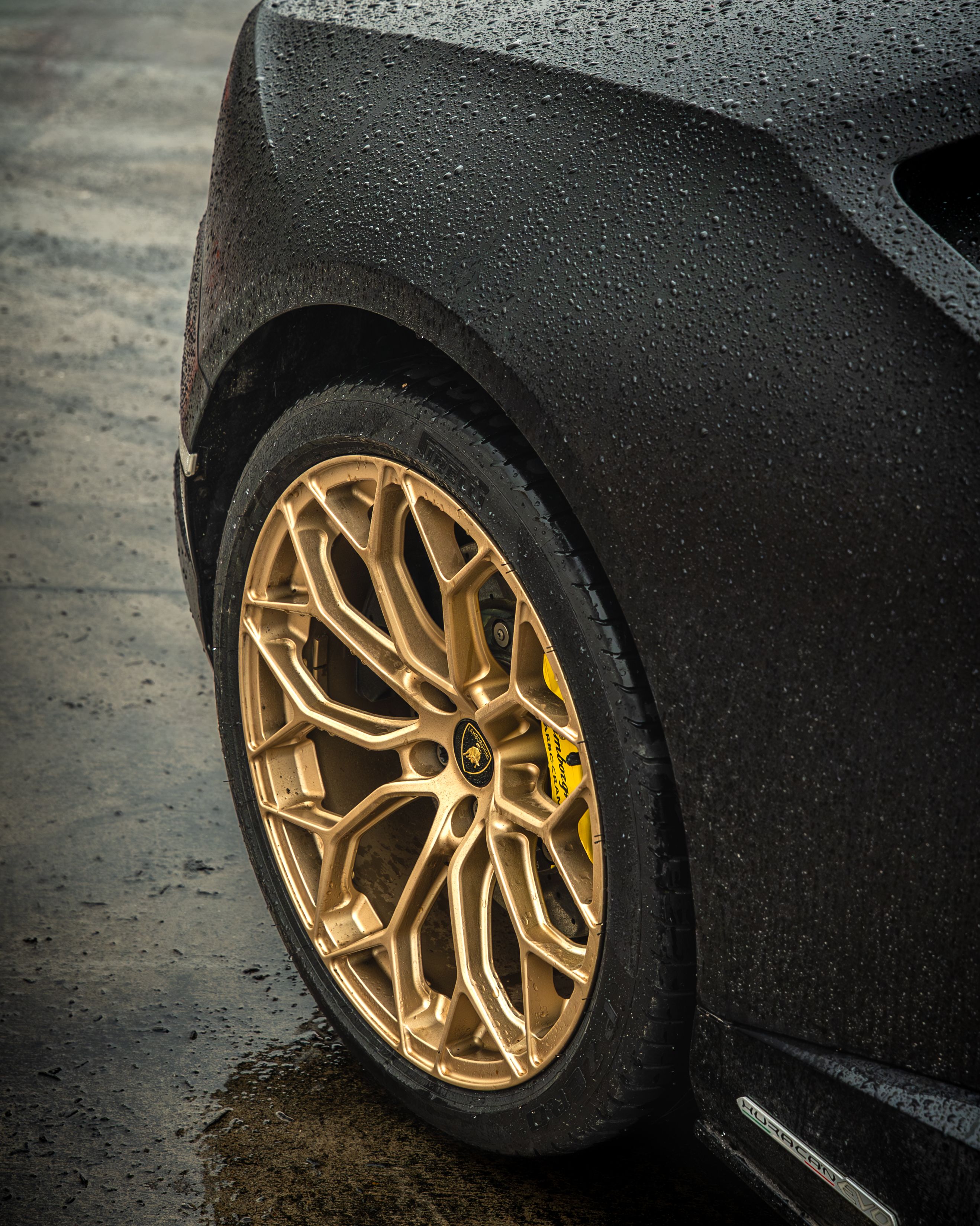 Close-up of Luxury Car Wheel on Rainy Day · Free Stock Photo
