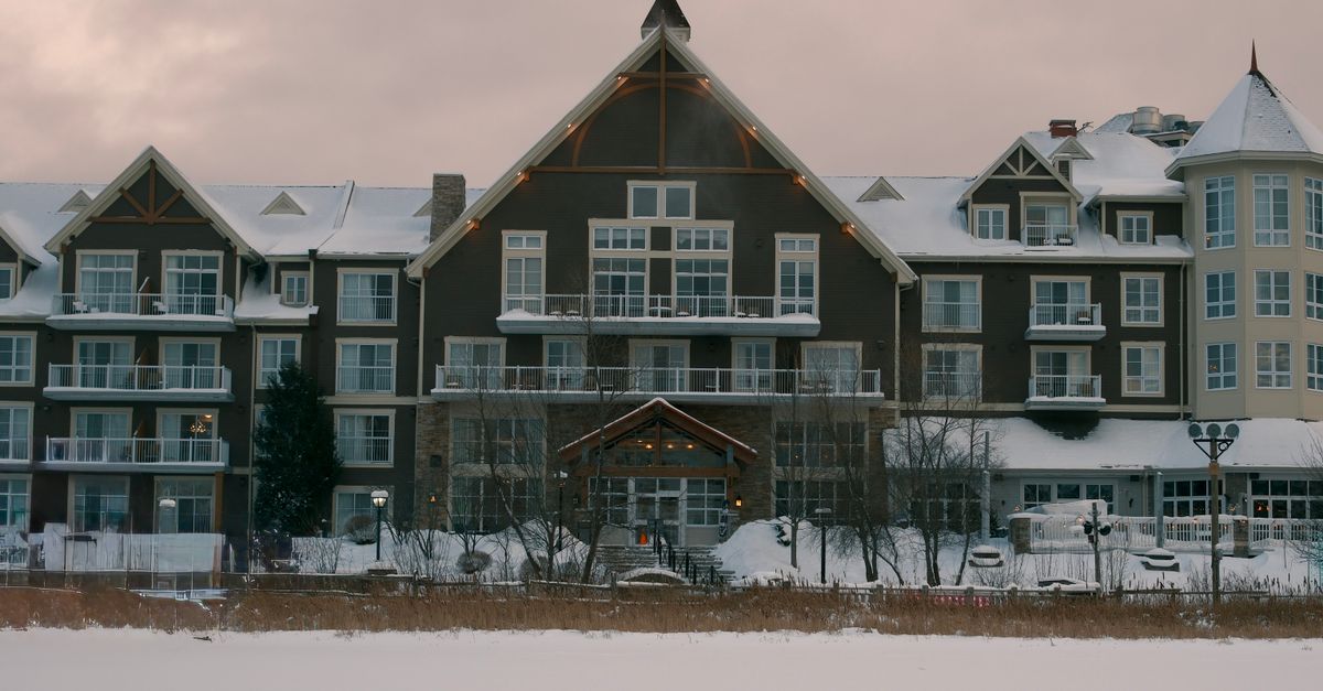 A picturesque snow-covered resort at Blue Mountain, Ontario, Canada under a winter sky.