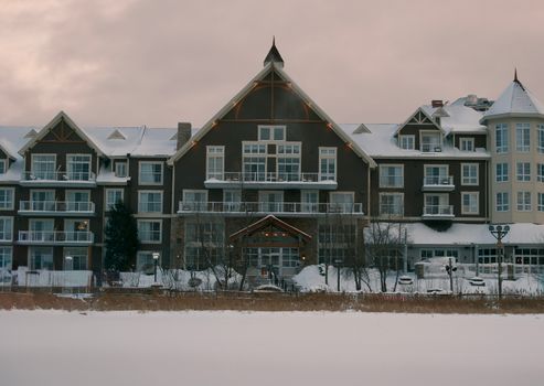 A picturesque snow-covered resort at Blue Mountain, Ontario, Canada under a winter sky.