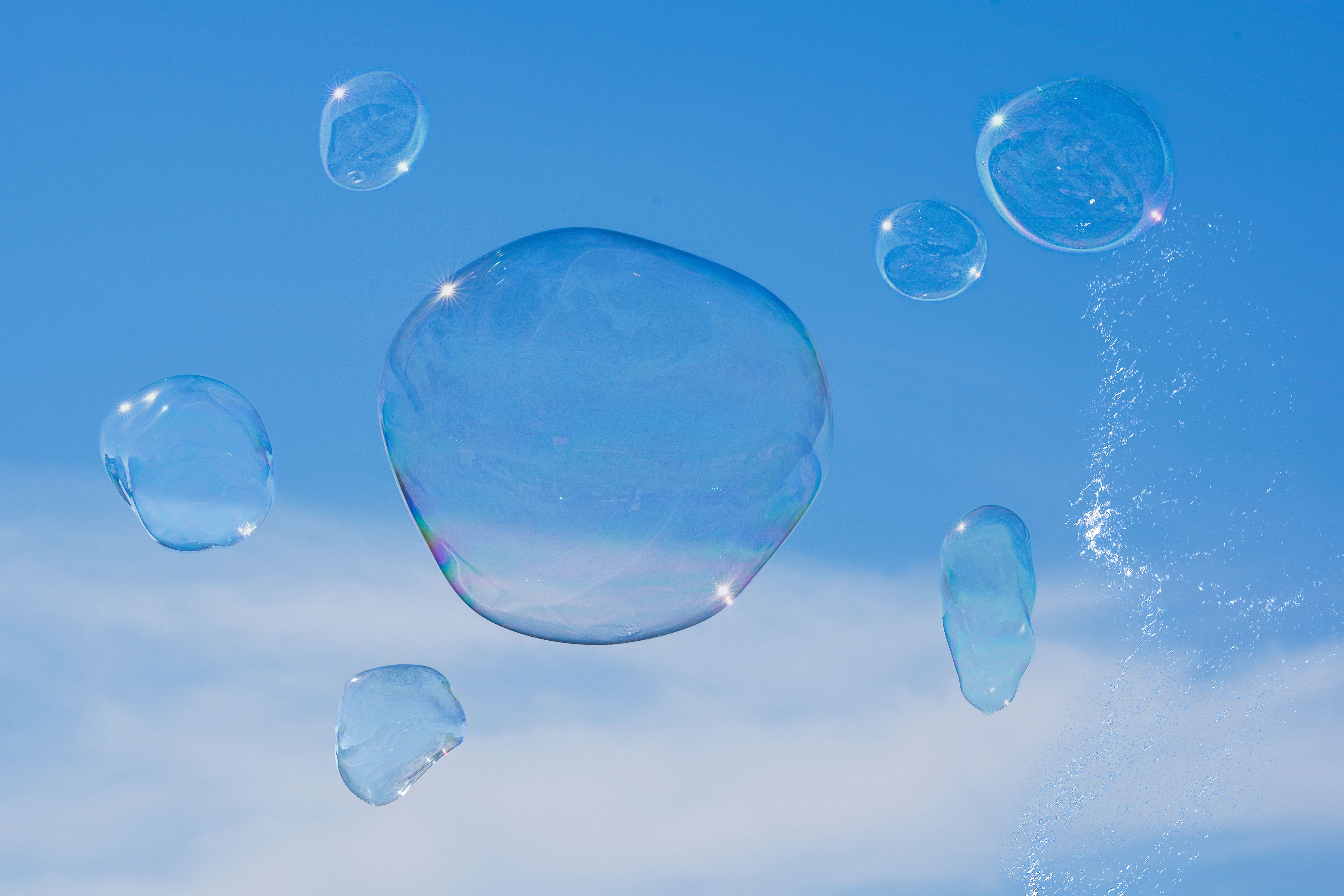 Floating Soap Bubbles in Blue Sky · Free Stock Photo